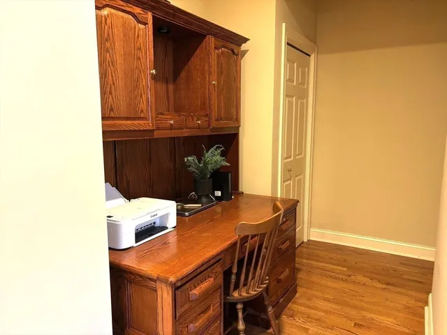 a dining room with furniture and a window