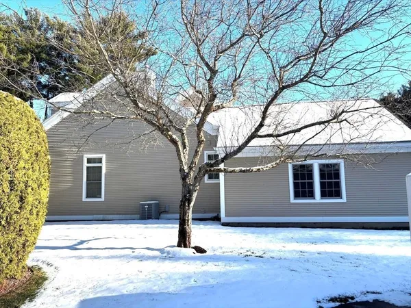 a house with trees in front of it