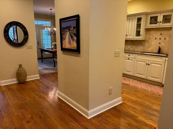 a kitchen with stainless steel appliances granite countertop a refrigerator and a stove