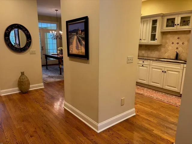 a kitchen with stainless steel appliances granite countertop a refrigerator and a stove