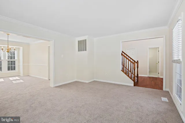 a view of an empty room with windows