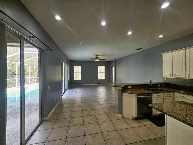 a kitchen with stainless steel appliances granite countertop a stove a sink and a granite counter tops