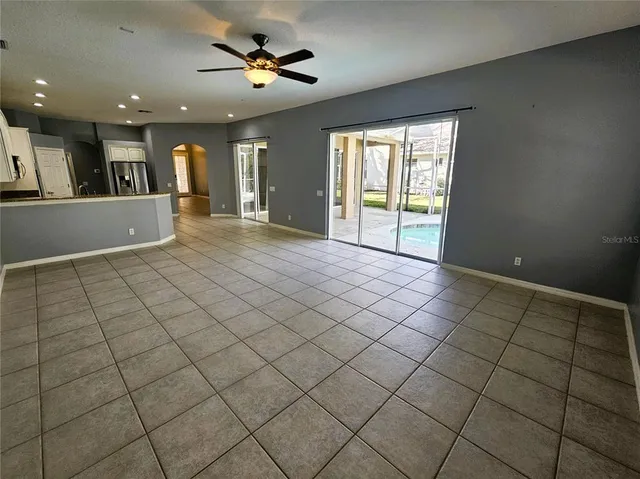 a view of an empty room and a window