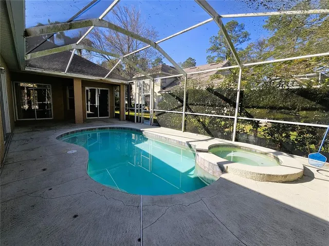 a view of a swimming pool with a patio