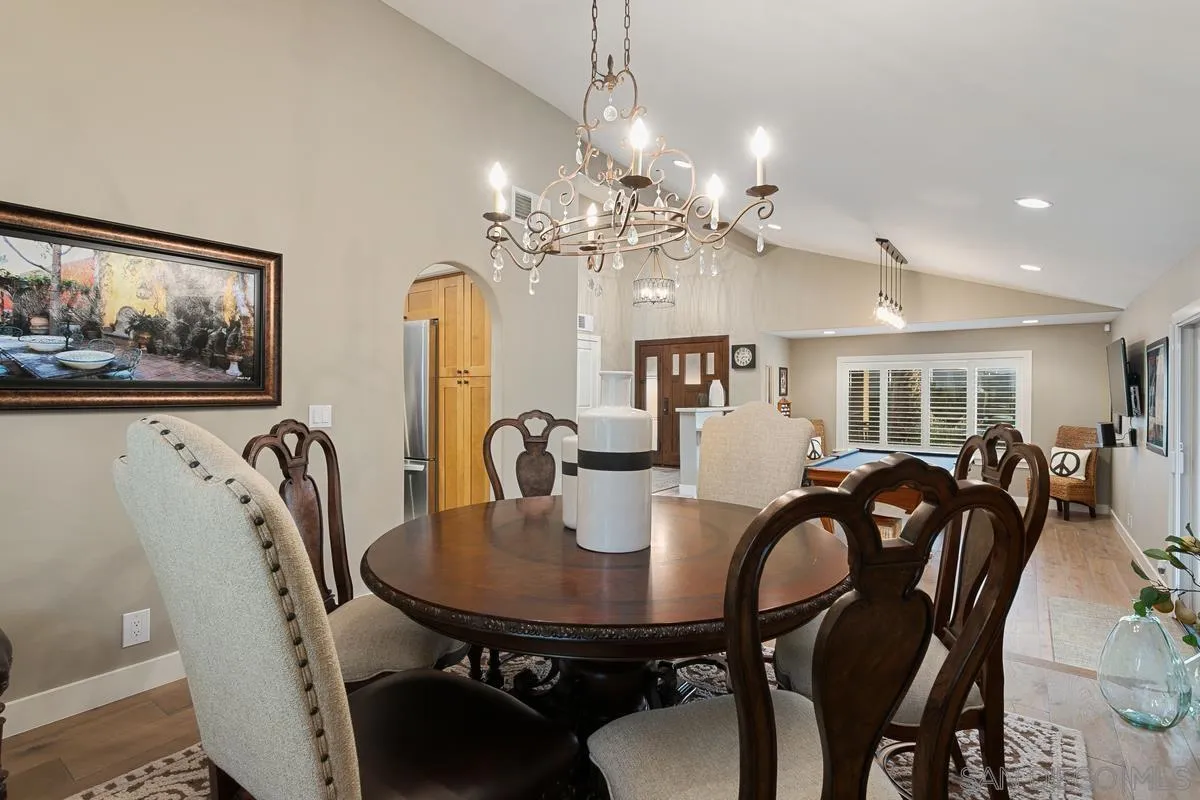 3526 Avenida Sierra Escondido, CA 92029 - Photo 12 of 36 a view of a dining room with furniture and chandelier