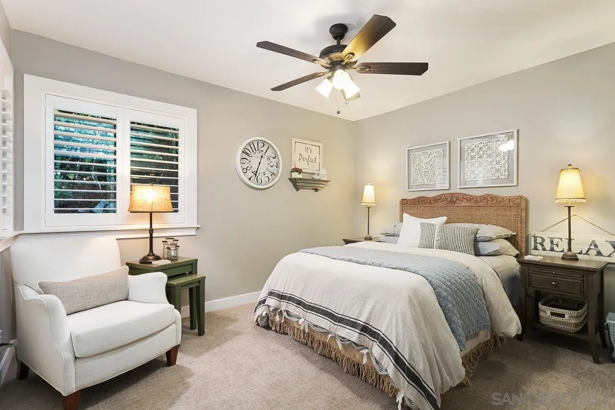 3526 Avenida Sierra Escondido, CA 92029 - Photo 15 of 36 a bedroom with a bed a couch and a window