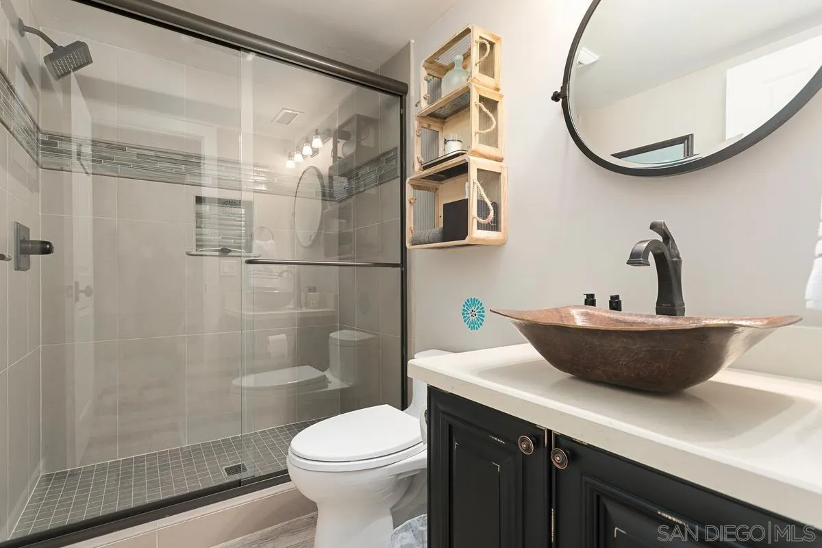 3526 Avenida Sierra Escondido, CA 92029 - Photo 16 of 36 a bathroom with a sink and a mirror