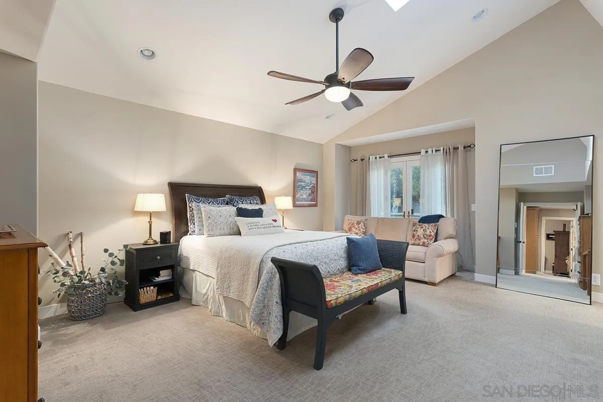 3526 Avenida Sierra Escondido, CA 92029 - Photo 17 of 36 a bedroom with bed and a chandelier