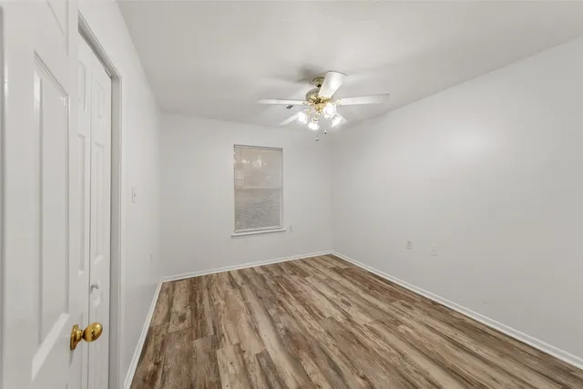 wooden floor in a room next to a window
