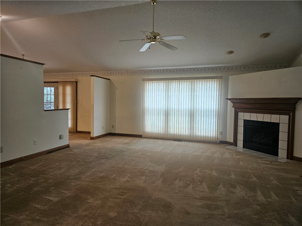 4909 Shannon Avenue Springfield, OH 45504 - Photo 5 of 21 Generous living area featuring a fireplace and abundant natural light.