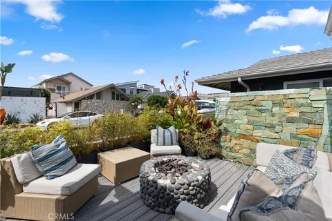 a view of a patio in back of a house