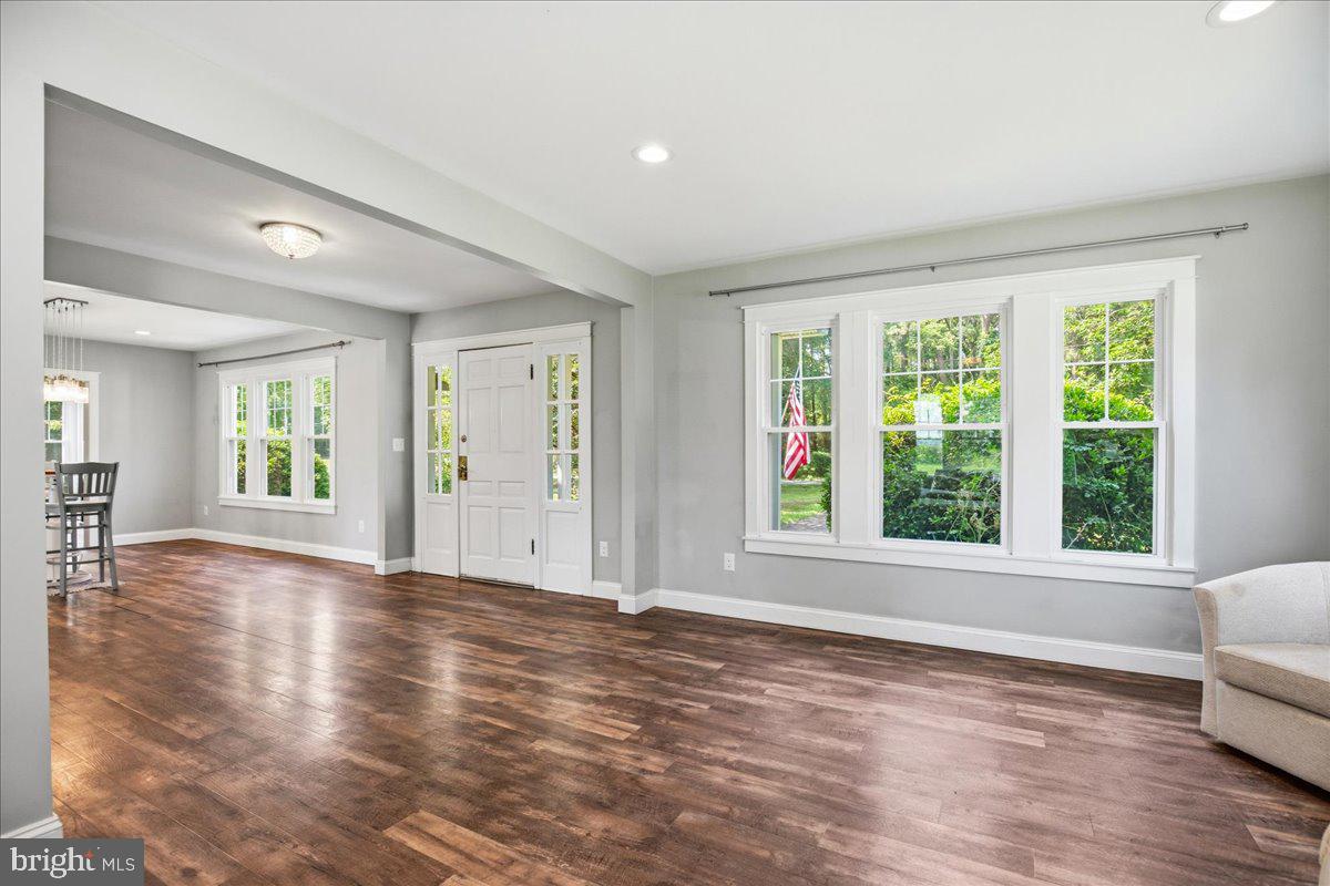 16146 Thomas Road Piney Point, MD 20674 - Photo 30 of 70 a view of an empty room with wooden floor and a window