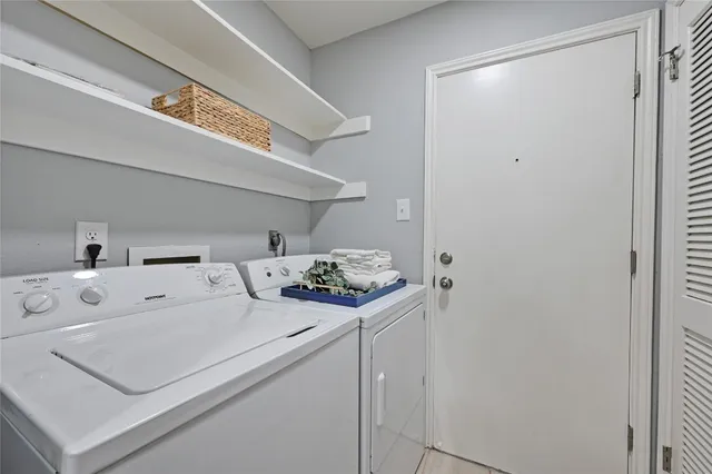 a utility room with dryer and washer