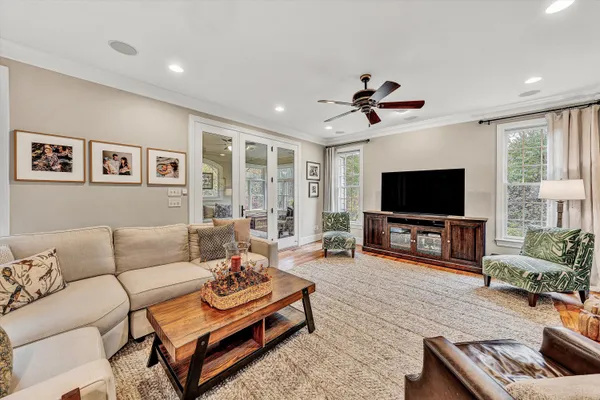 a living room with furniture and a large window