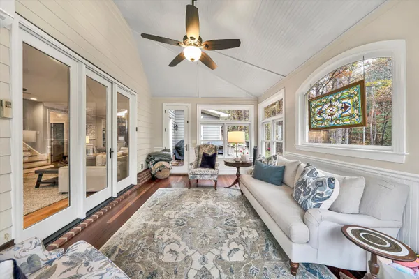 a kitchen with stainless steel appliances granite countertop a stove a sink dishwasher and cabinets with wooden floor