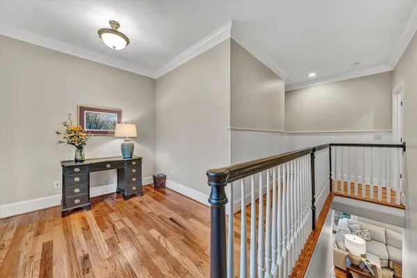 a living room with furniture and a book shelf