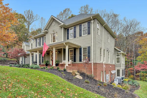 a view of a hallway with paintings on the wall