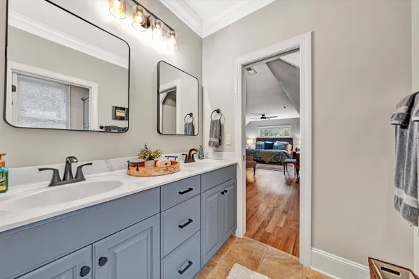 a bathroom with a sink a toilet and shower curtain