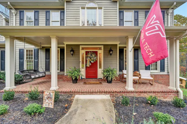 a view of a hallway with wooden floor and closet