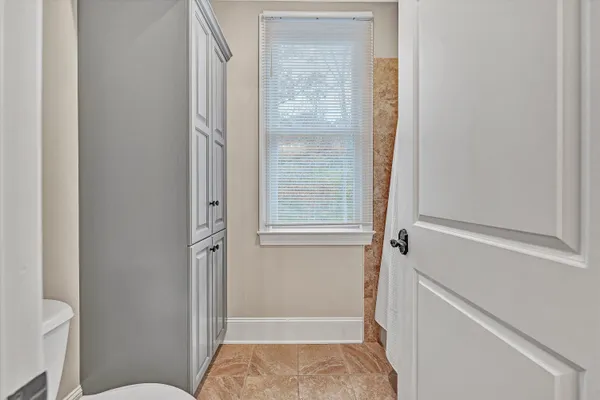a view of a livingroom with furniture and closet