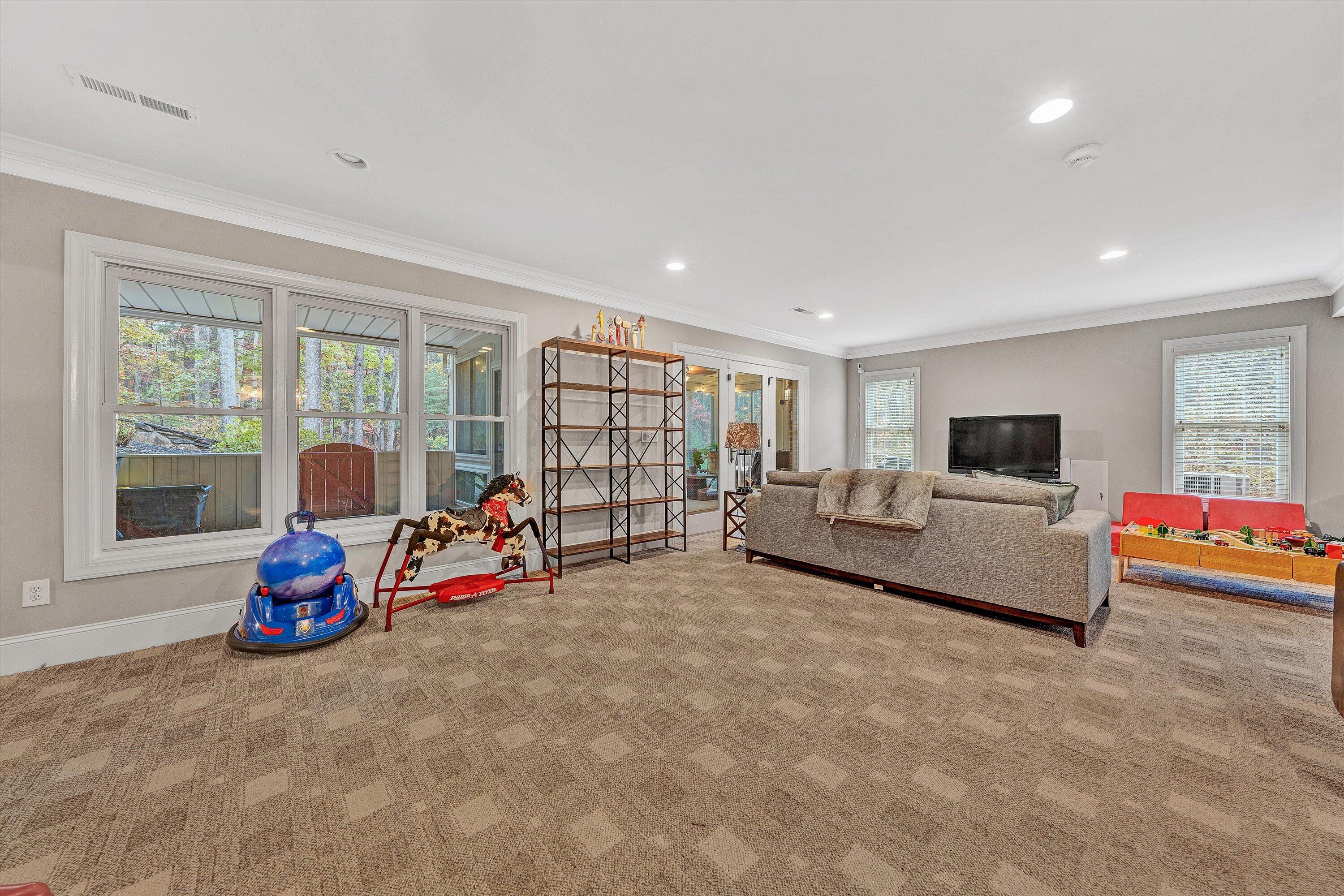 5431 Ridgelea Estates Drive Roanoke, VA 24018 - Photo 47 of 71 a living room with furniture and a flat screen tv