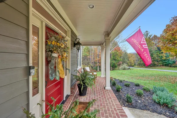 a workspace with furniture fire place and a window