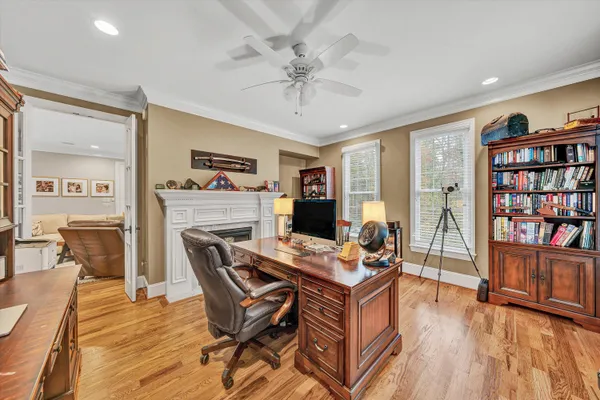 a view of a dining room with furniture wooden floor and chandelier
