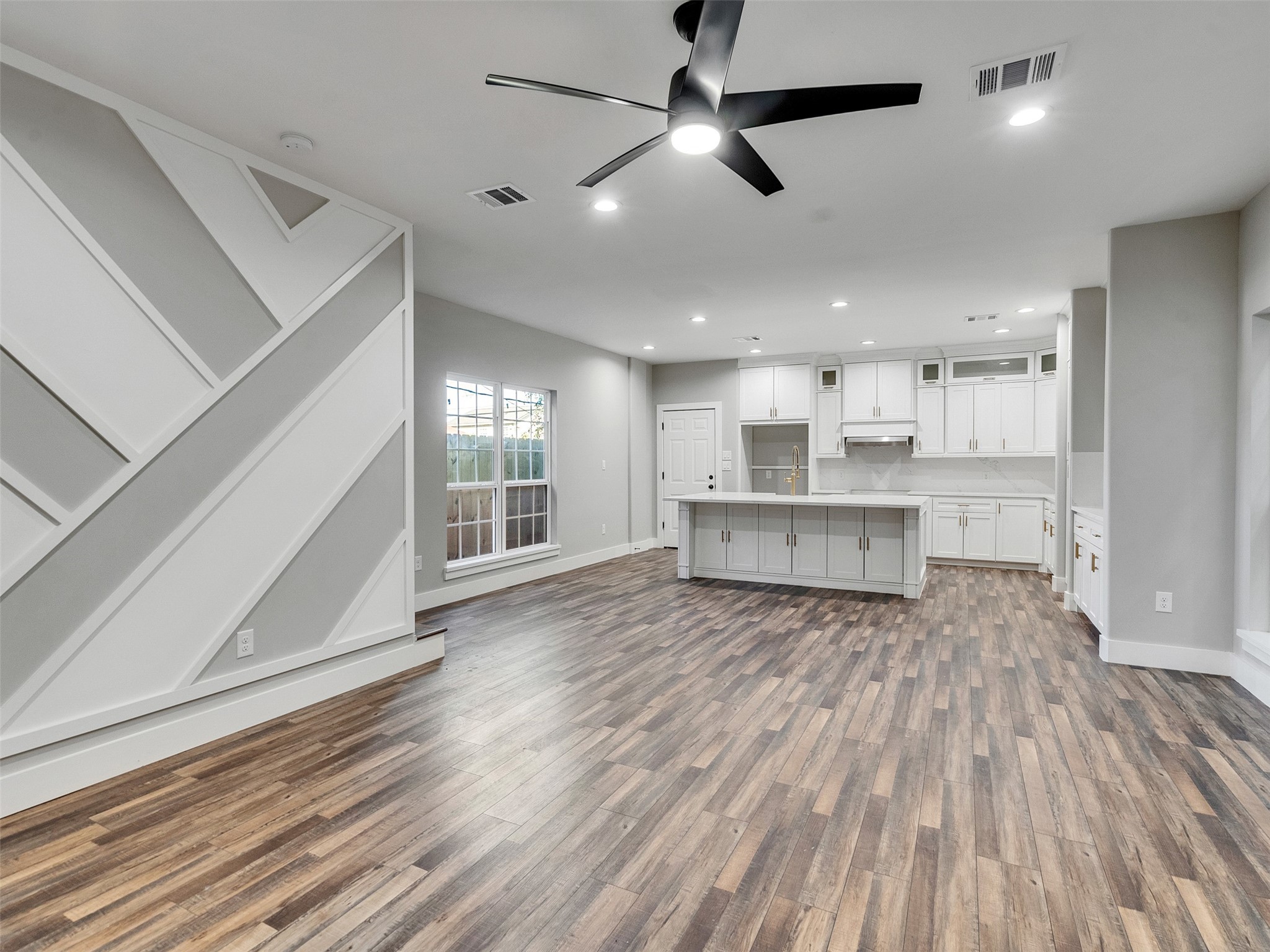 a view of kitchen and wooden floor