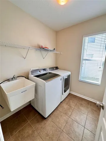 a utility room with dryer and washer