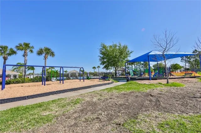 a view of a house with backyard and porch