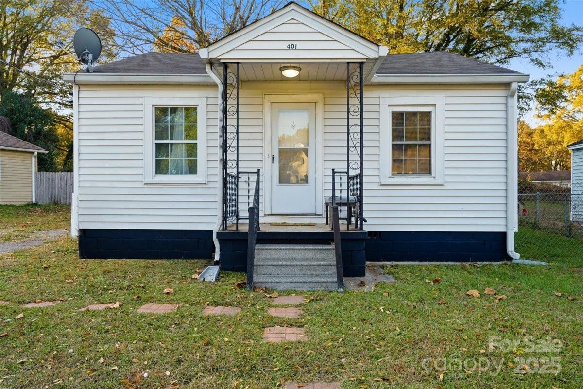 401 North Myrtle Street Gastonia, NC 28052 - Photo 1 of 14 a front view of a house with garden