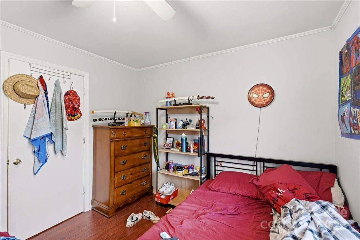 401 North Myrtle Street Gastonia, NC 28052 - Photo 11 of 14 a bedroom with a bed and a window