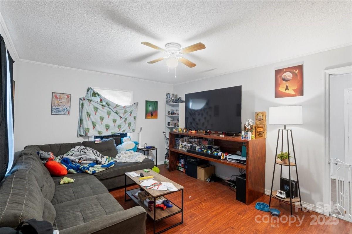 401 North Myrtle Street Gastonia, NC 28052 - Photo 3 of 14 a living room with furniture and a flat screen tv