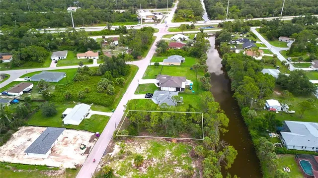 an aerial view of house with yard swimming pool and outdoor seating