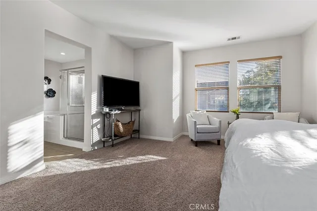 a bathroom with a double vanity sink and mirror