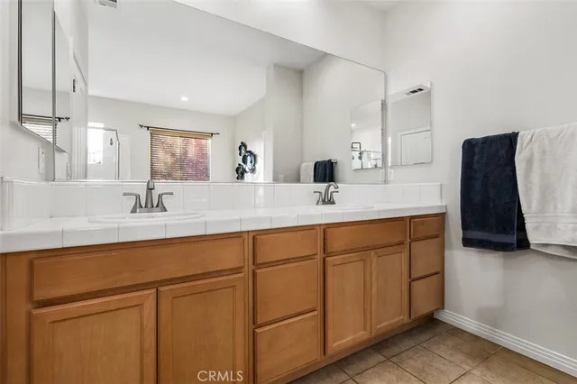 a bathroom with a tub a sink and a window