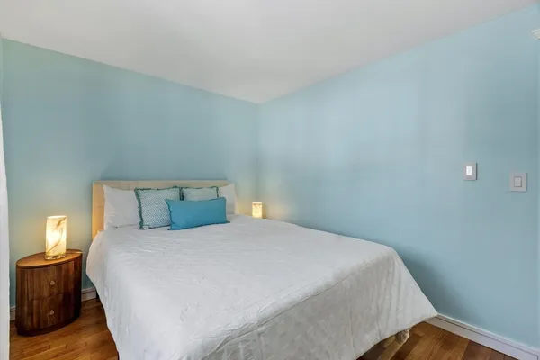 a bedroom with a bed and a desk