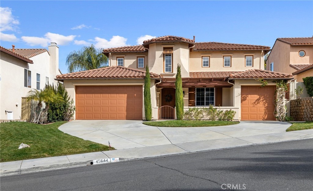 45644 Camino Rubi Temecula, CA 92592 - Photo 1 of 51 a front view of a house with a garden
