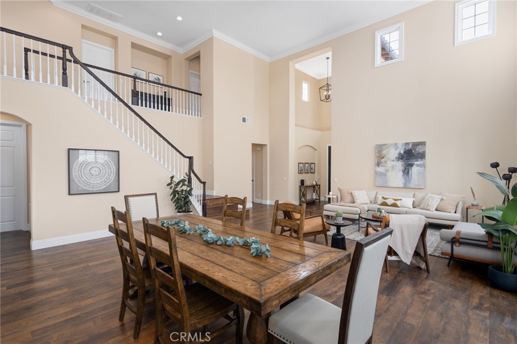 45644 Camino Rubi Temecula, CA 92592 - Photo 49 of 51 a dining room with wooden floor a table and chairs
