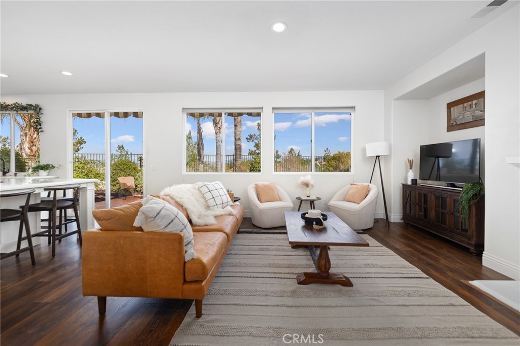 45644 Camino Rubi Temecula, CA 92592 - Photo 8 of 51 a living room with furniture or couch and a flat screen tv