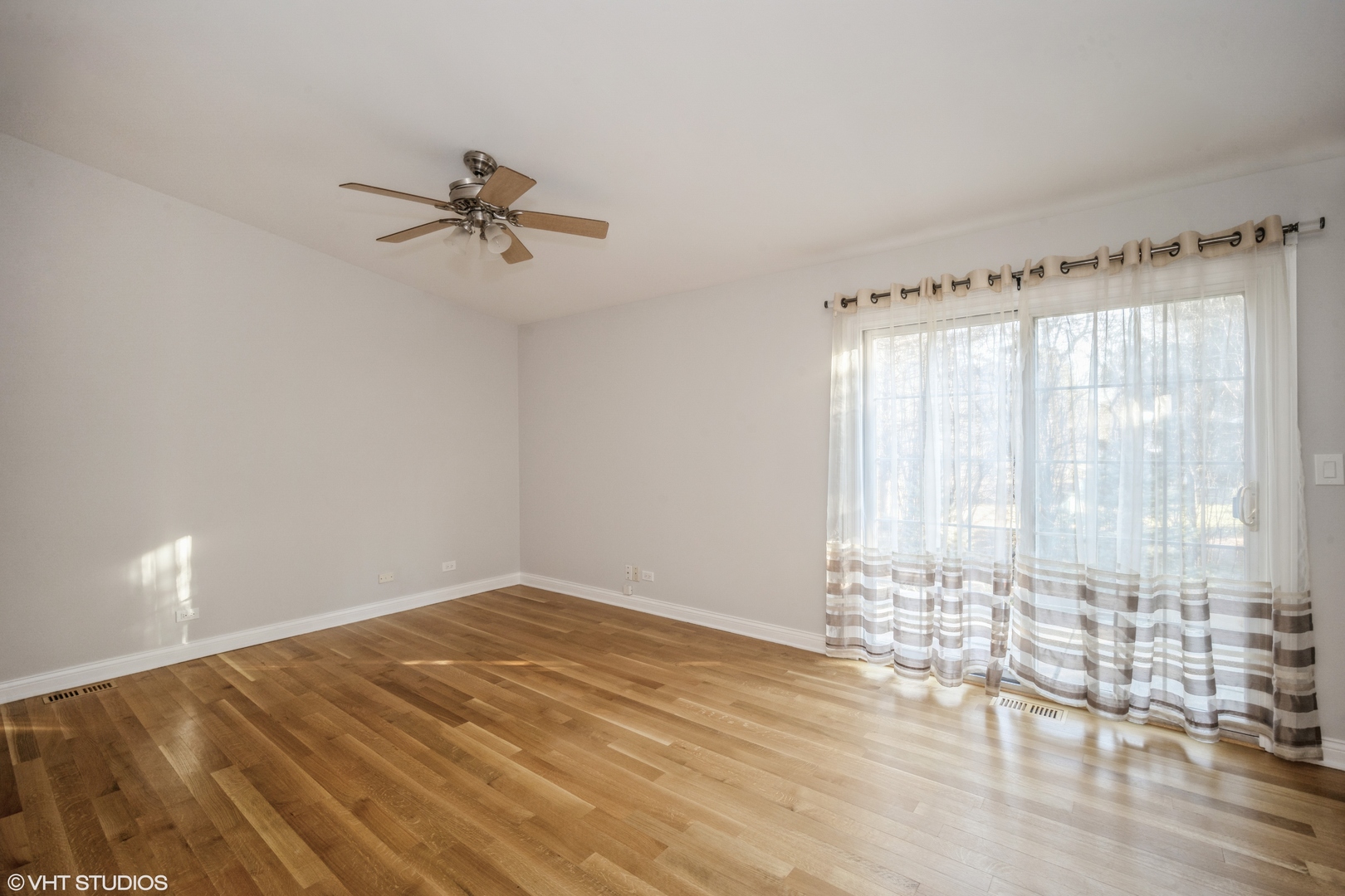 Undisclosed Address Northbrook, IL 60062 - Photo 7 of 9 wooden floor in an empty room with a window