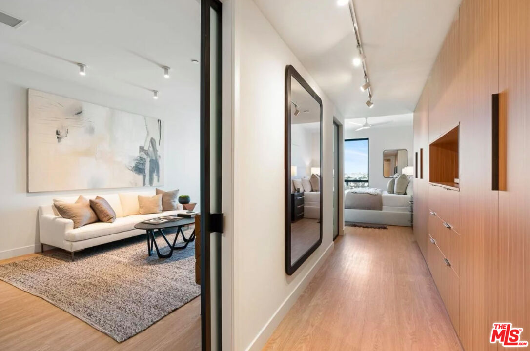 a living room with furniture and a rug