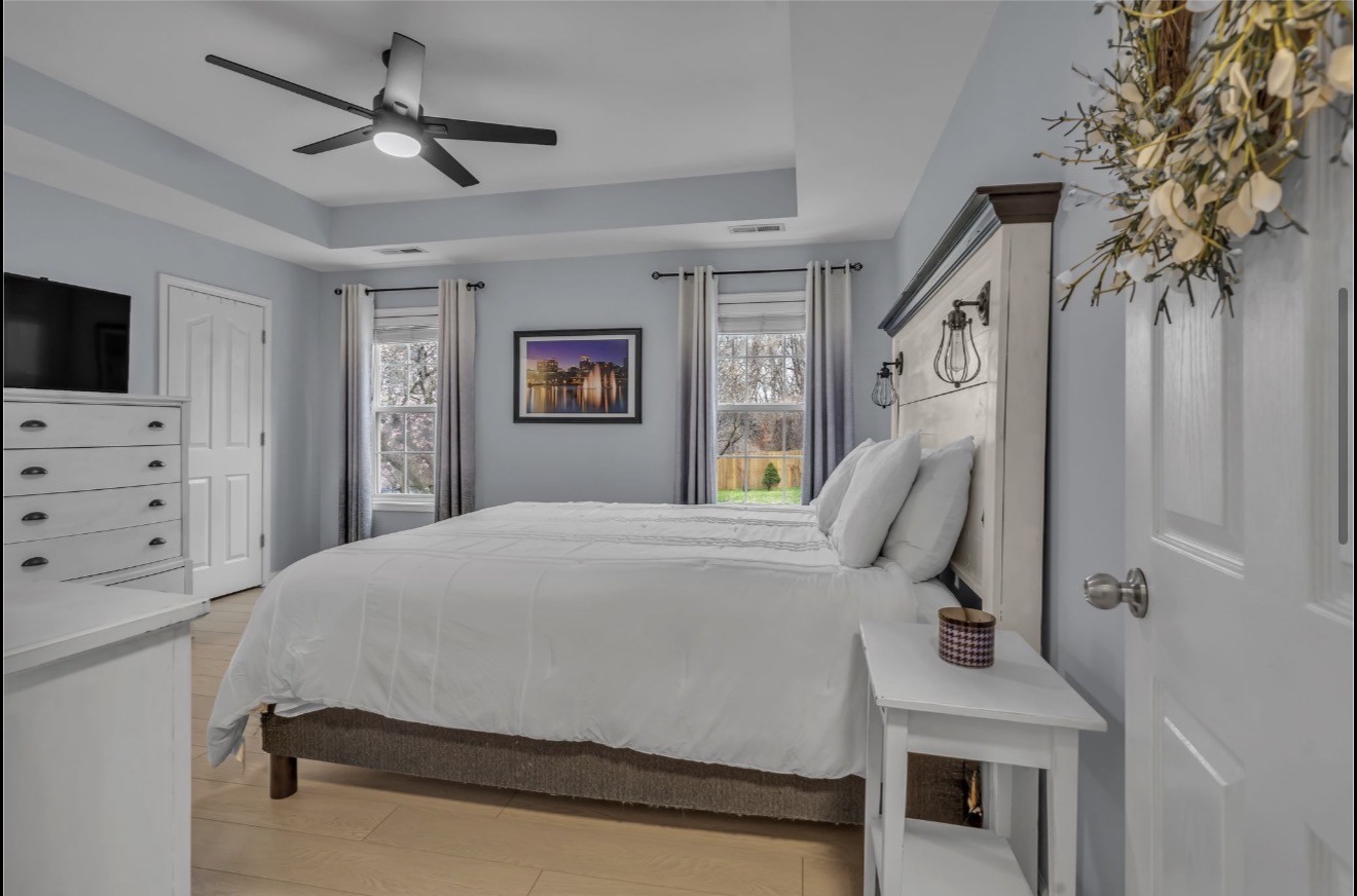 1589 Hedgewood Road Clarksville, TN 37042 - Photo 15 of 30 a bedroom with a bed and a chandelier