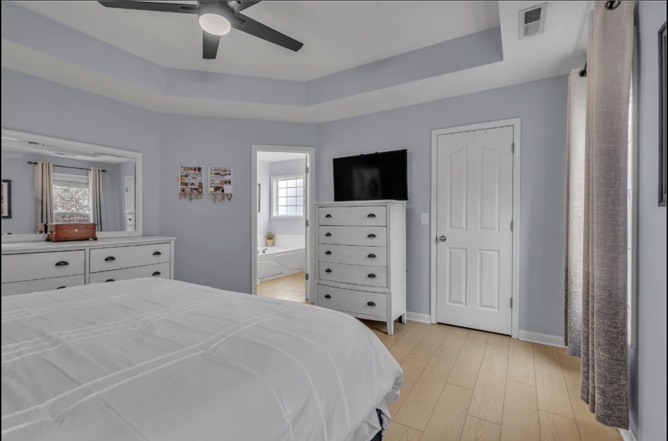 1589 Hedgewood Road Clarksville, TN 37042 - Photo 16 of 30 a bedroom with a bed and a flat screen tv