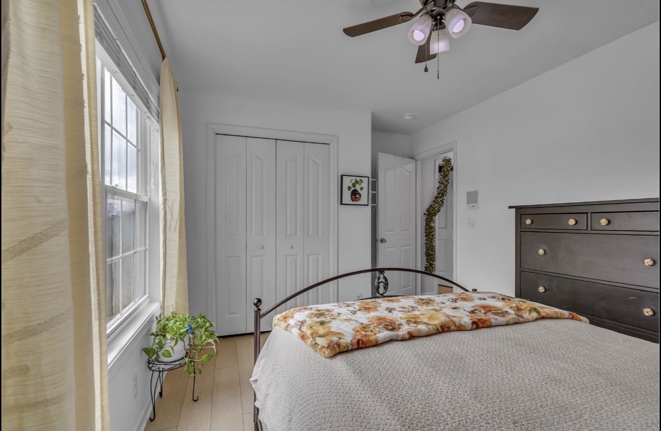 1589 Hedgewood Road Clarksville, TN 37042 - Photo 24 of 30 a bedroom with a bed and a chandelier