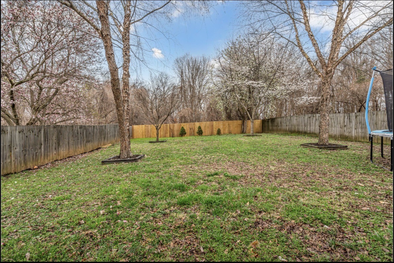1589 Hedgewood Road Clarksville, TN 37042 - Photo 30 of 30 a view of a backyard with large trees