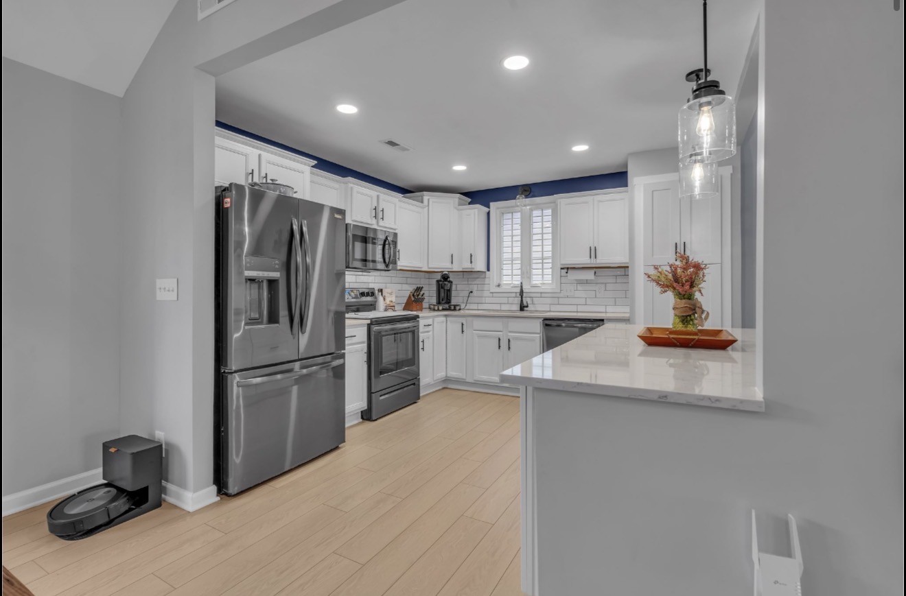 1589 Hedgewood Road Clarksville, TN 37042 - Photo 8 of 30 a kitchen with refrigerator cabinets and furniture