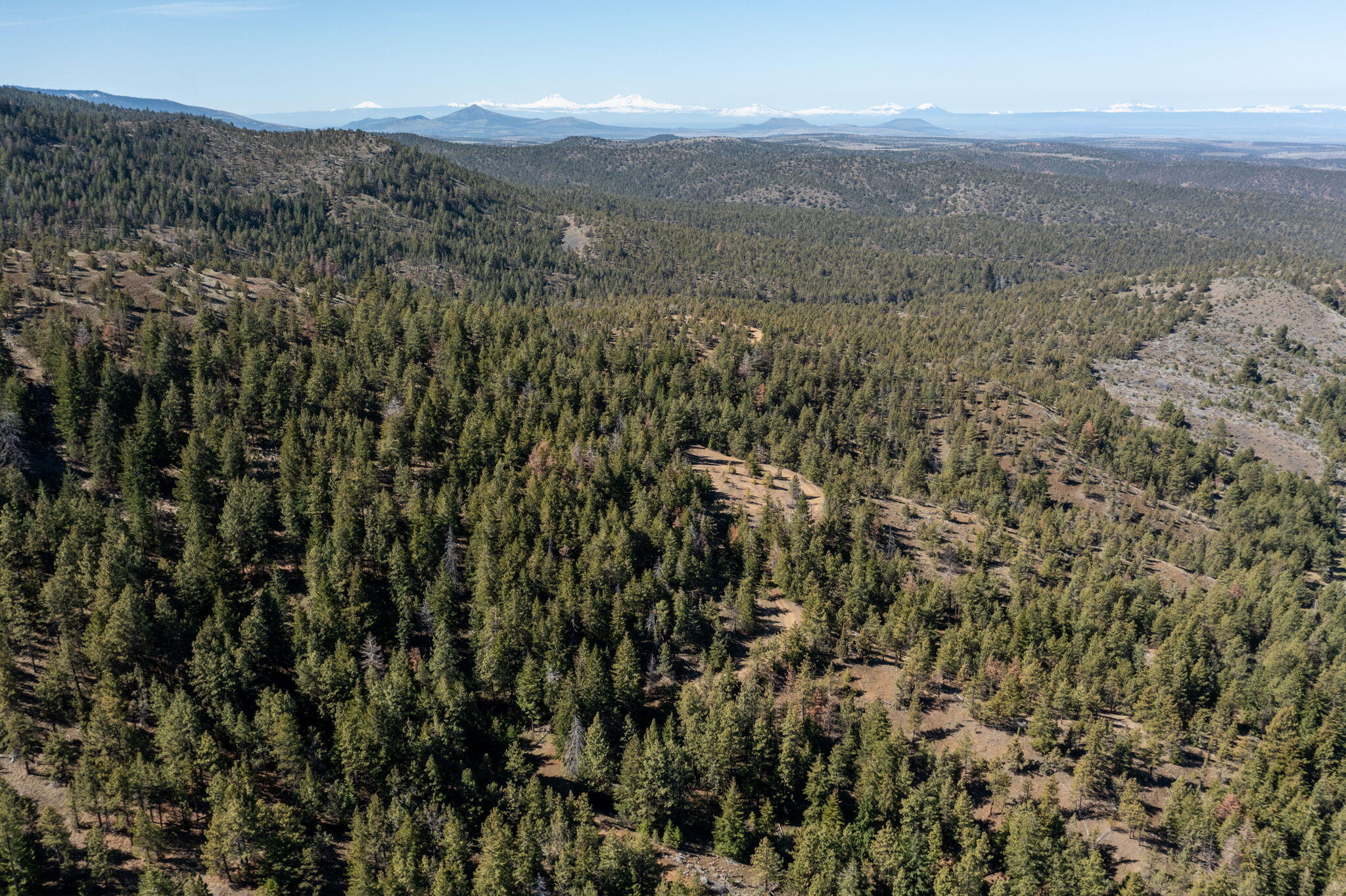0 Southeast Grizzly Road, Unit 1215000000100 Madras, OR 97741 - Photo 16 of 39 a view of a city with mountains in the background