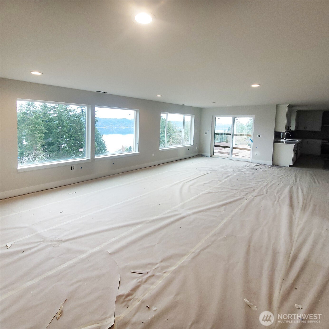 320 East 4th Street Union, WA 98592 - Photo 11 of 35 a large bedroom with a large bed and a large window