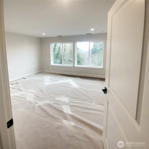 a bathroom with a double vanity sink mirror and shower